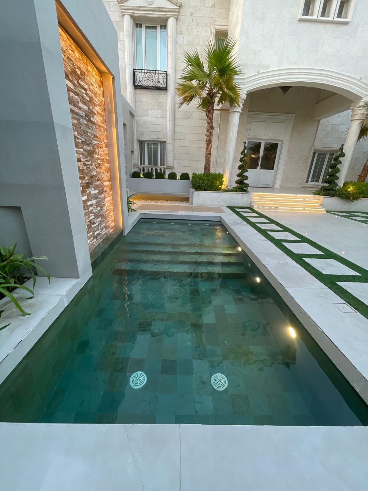 Modern swimming pool at dusk
